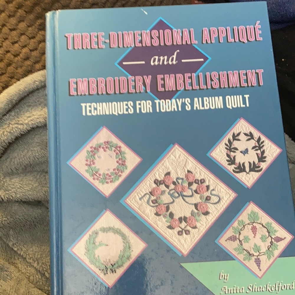Three dimensional appliqué and embroidery embellishment book